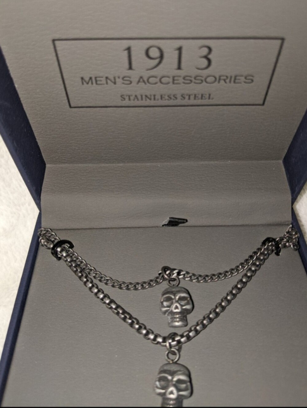 Stainless steel skull necklace. It's a men's brand necklace, but it's Unisex